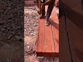 The Process of Splitting Red Wood Logs Using Axes