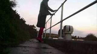 Thigh length boots by the railings