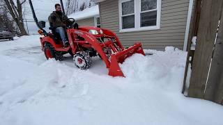 Kubota bx plowing snow (Up to 2' drifts!)