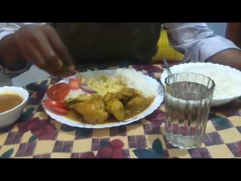 Eating lunch with Chicken Curry , Rice and Salad