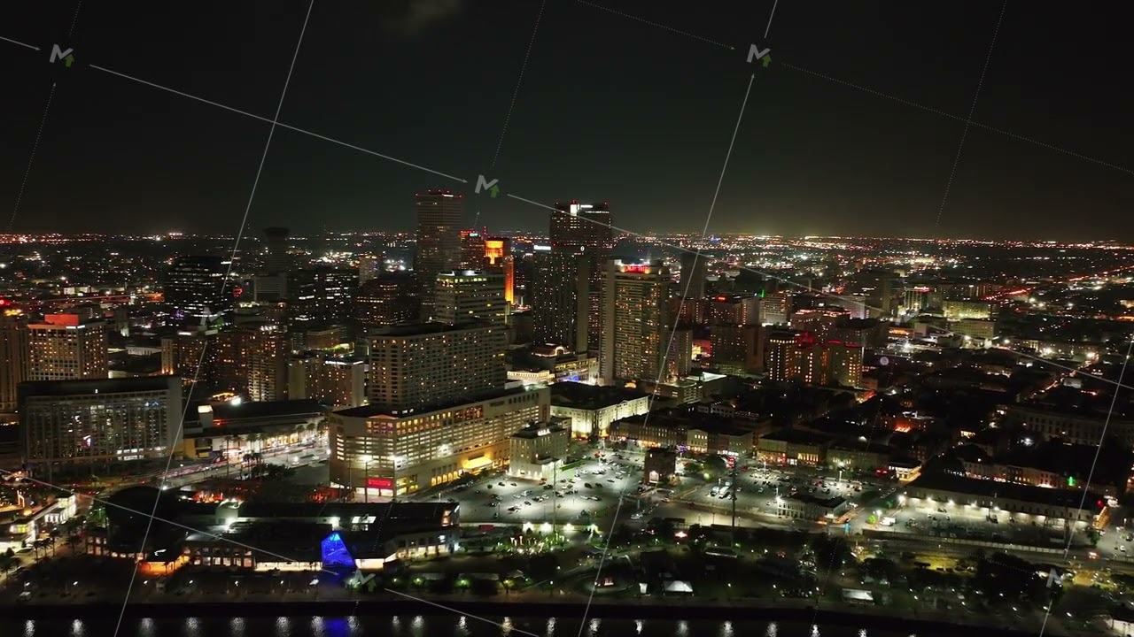 Vibrant night skyline of New Orleans with this stunning aerial footage. City's illuminated buildings