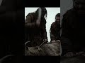 wild people killing a goat