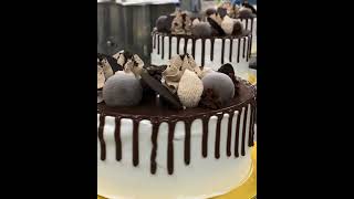 The Decorating of our Signature Cake