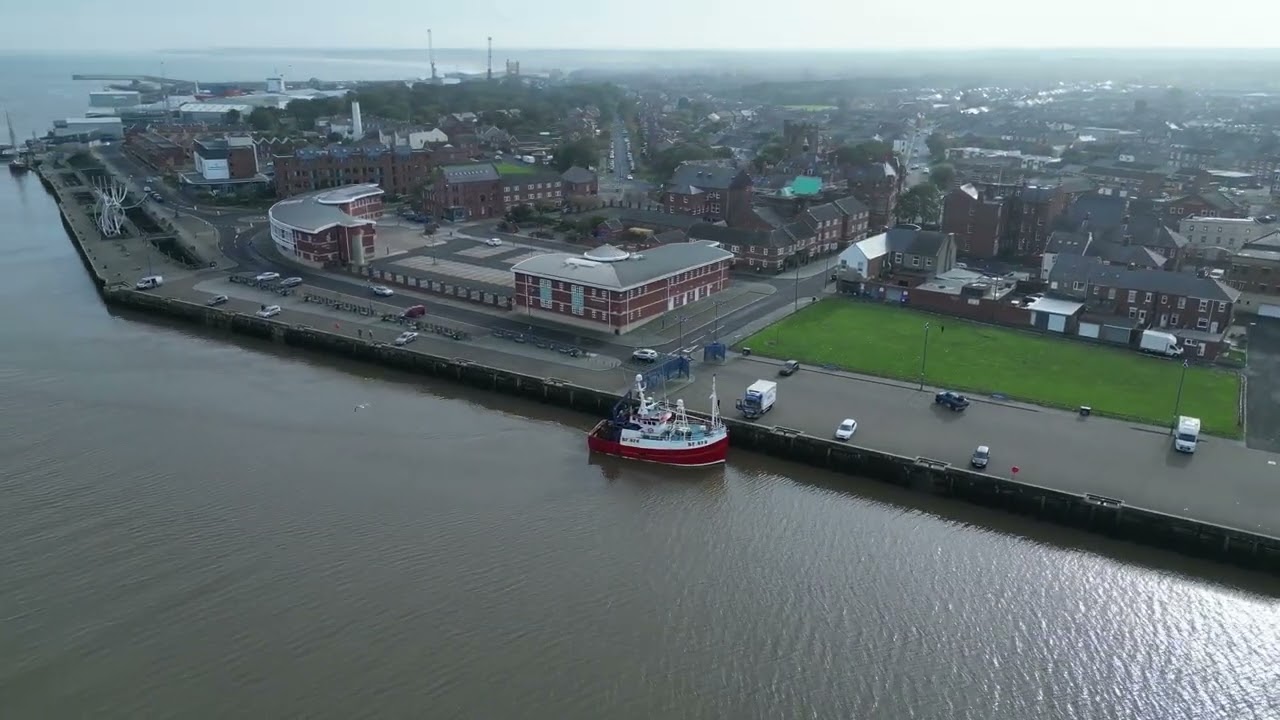 Fishin trawler entering the river Blyth from sea, Northumberland UK