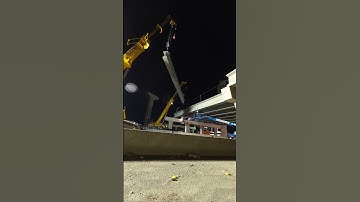 Installing Concrete Girders For A Future Roadway Bridge Using Large Cranes