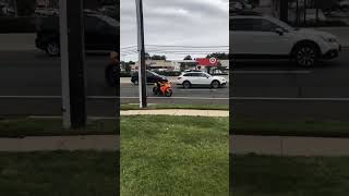 Guy swerves and falls off motorcycle