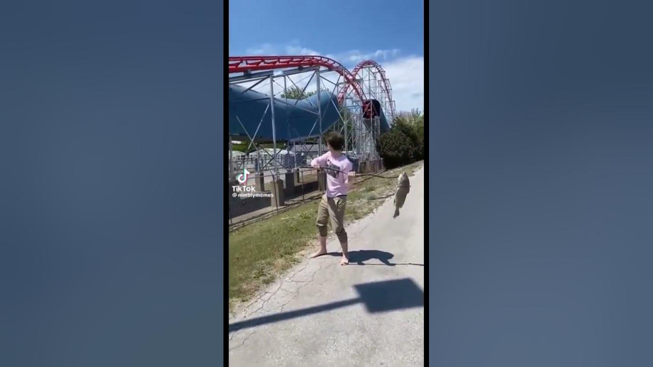 Guy throws fish at rollercoaster😂😂 YouTube
