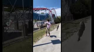 Guy Throws Fish At Rollercoaster