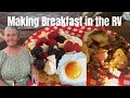 Cooking breakfast in rv  sourdough pancakes  farm fresh eggs  sausage  blue and red raspberry