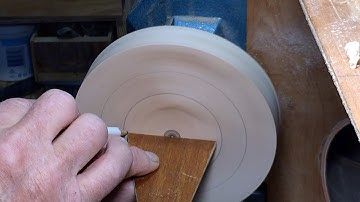 Richard Raffan marking centre and laying out diameters on a wood lathe.