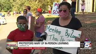 Lawrence teachers, parents protest returning to class