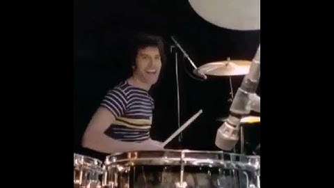 Thumbnail of Freddie Mercury playing drums and Roger Taylor playing guitar