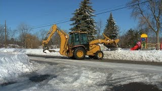 Crystal Crews Cleaning Out Icy Drains