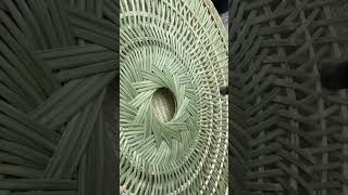 Heated irons smooth large bamboo weaving carefully, pressing both inner and outer surfaces evenly.