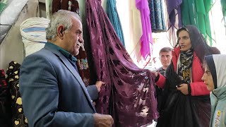 Buying clothes with the financial help of the viewers and in cooperation with the film director
