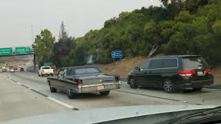 1969 Cadillac Deville Convertible driving on the freeway