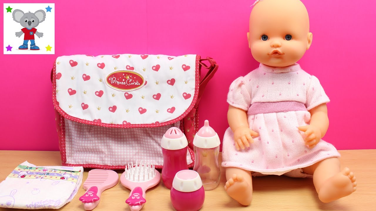 Bolso con 30 Accesorios para la muñeca Bebé  La Bebé nenuco come papilla y  se baña en la bañera 