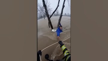 Heart-Stopping Moment: Man Pulled from Raging Floodwaters😳#unbelievable #flood #viralshorts #rescue