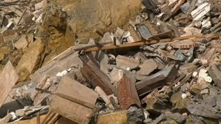 Italian cemetery collapse sends hundreds of coffins into the sea