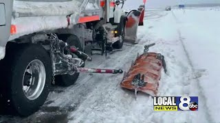 Snow plow hit by passing driver