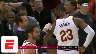 Lebron james gets fouled -- and scratched up on a drive to the basket
in first quarter of cleveland cavaliers' game against toronto raptors.
✔...
