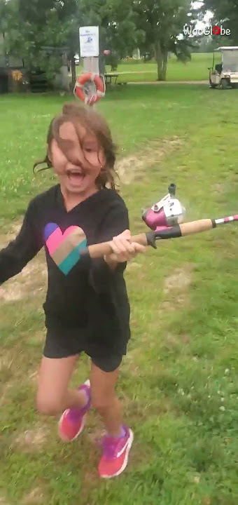 Little girl catches her first fish