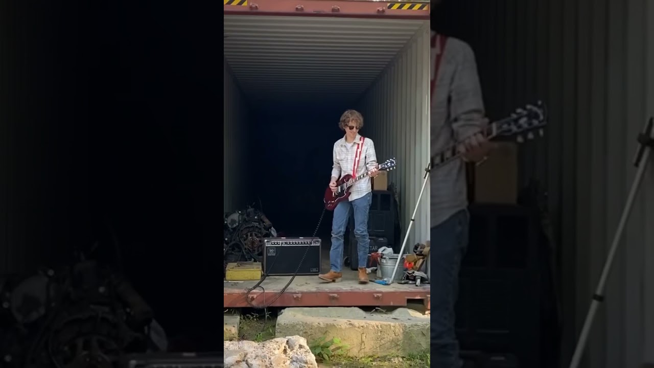 Playing guitar at inside Diesel Creek’s shipping container #guitarist #