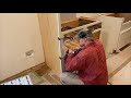 Episode 222: Kitchen cabinets: installing the refrigerator side panels and the first base cabinet!