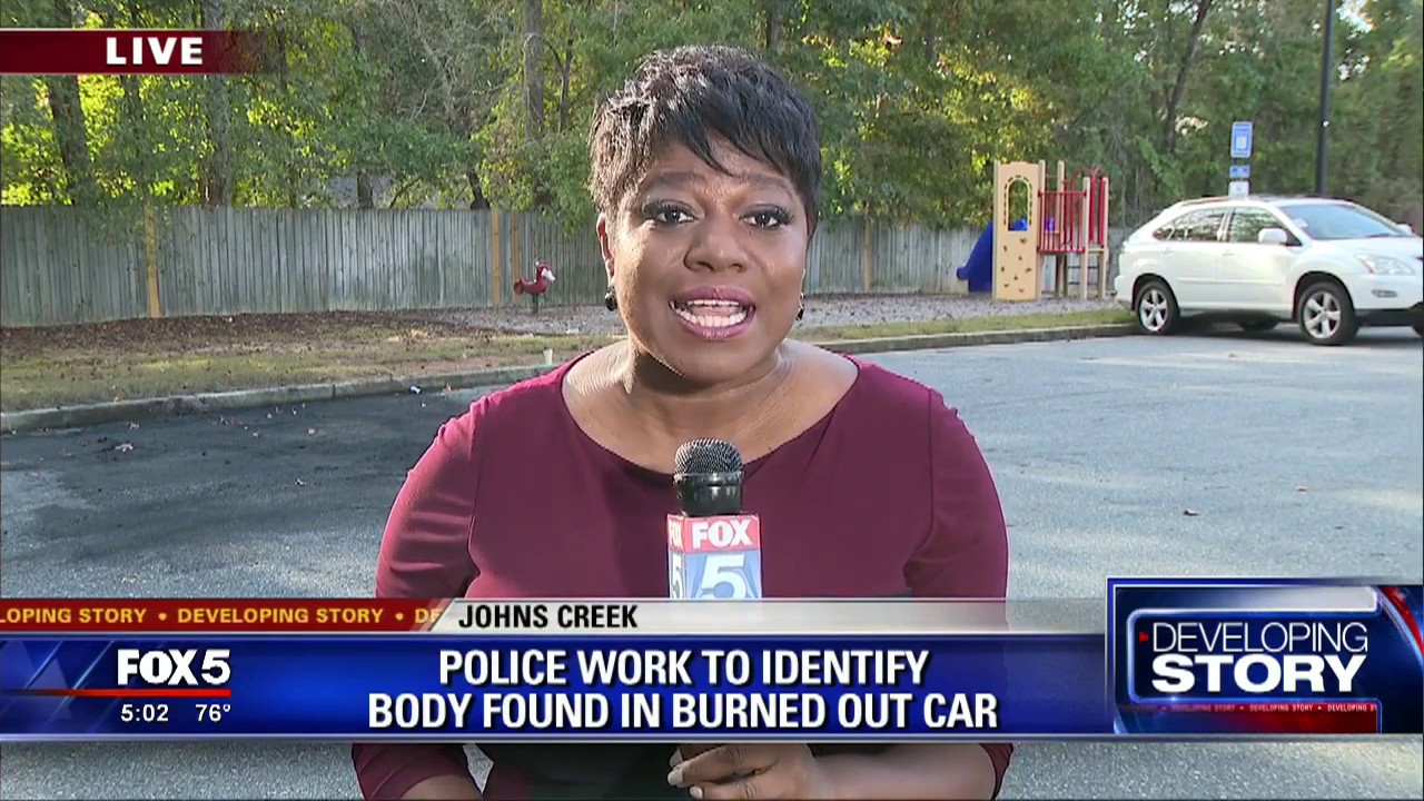 Police work to identify body found in burned out car - YouTube