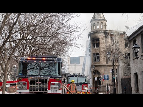 Massive fire rips through Old Montreal | More than 100 firefighters called to scene