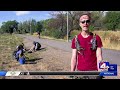 Volunteers cleanup weeds, trash along Jordan River