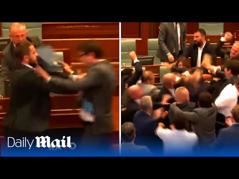 Shocking moment Kosovo parliament erupts into mass brawl after Prime Minister's speech