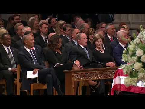 Touching moment George W  Bush sneaks candy to Michelle Obama at John McCain’s funeral