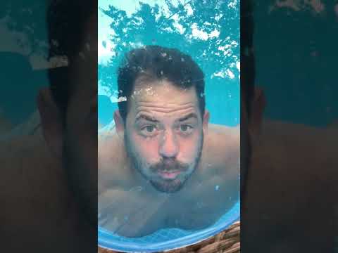 funny-pool-video..-man-swims-underwater-into-pool-window