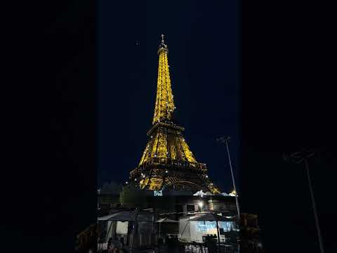 Eiffel Tower lighting at night nighttime Paris France 2024