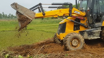 JCB leveling soil and land planning- Jcb Backhoe Machine pushing mud