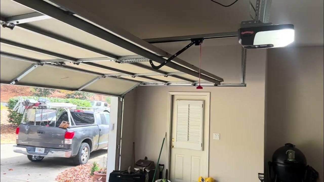 Car backed into garage door. Door out of tracks repair. Clopay Garage