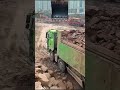 Excavators Load Soil Onto Trucks