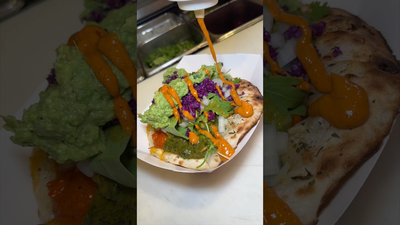 HALF CHICKEN TIKKA HALF SAAG PANEER GARLIC CHEESE NAAN TACO from TACO MAHAL in NYC!! 🔥 #DEVOURPOWER
