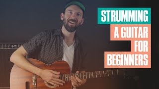 Strumming a Guitar for Beginners | Guitar Tricks screenshot 2