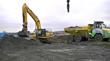 JCB JS 330 Excavator Loading a Terex TA300 With Muck 1