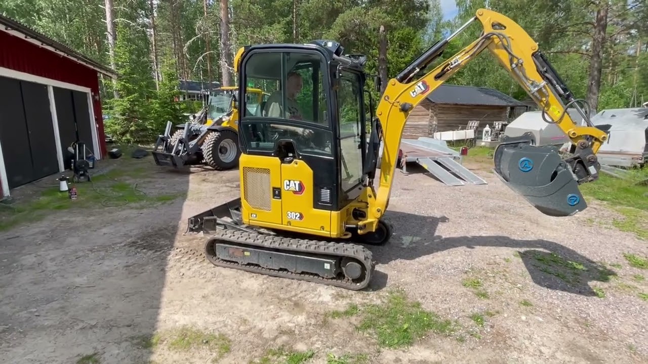 Minigrävare med redskap CAT 302