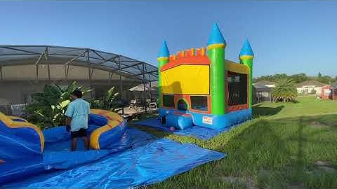 Roll up the 15 feet tall inflatable waterslide and castle bounce house - August 2, 2020