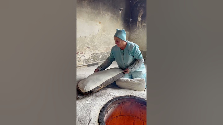 Baking Armenian lavash bread in traditional way