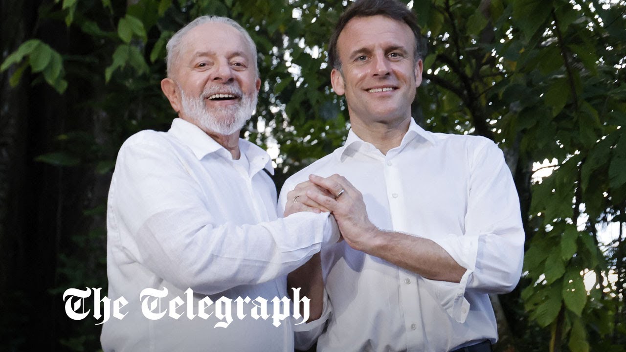 Watch: Macron holds hands with Brazilian president on Amazon trek