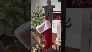 Christmas stocking holder post with double hooks.