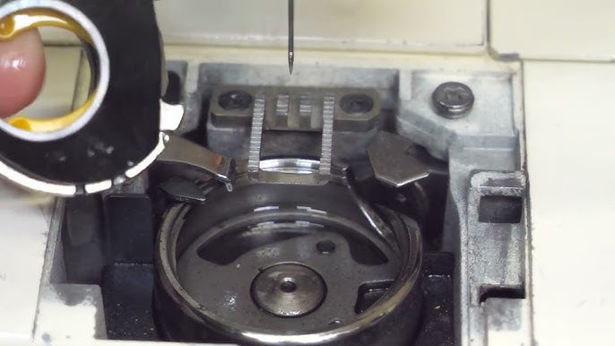 Kenmore sewing machine bobbin area debris removal