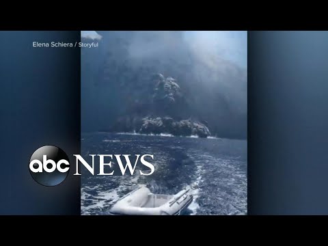 Island volcano of Stromboli erupts right in front of tour boat