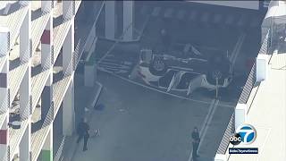 Car falls from 3rd level of parking structure at Beverly Connection shopping center | ABC7