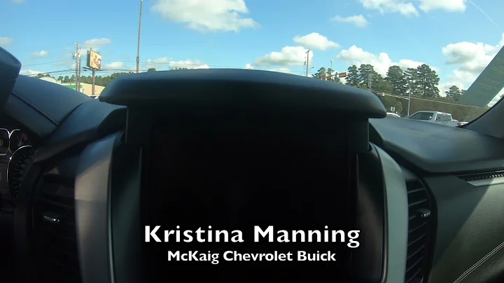 Kristina shows the secret compartment on a Yukon